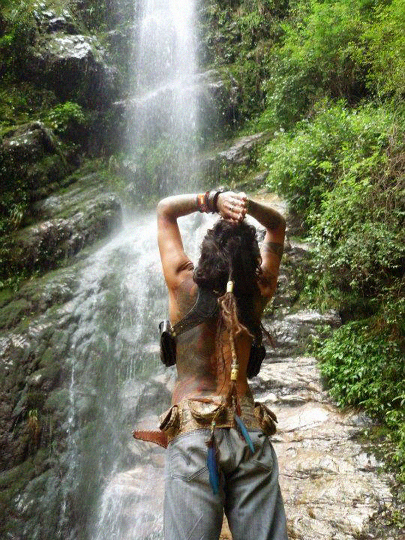 Imix Jaguar by a waterfall near his home in the jungle of Palenque, Mexico. 