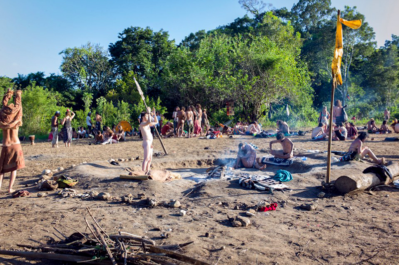 People around the sacred fire in the main circle area.