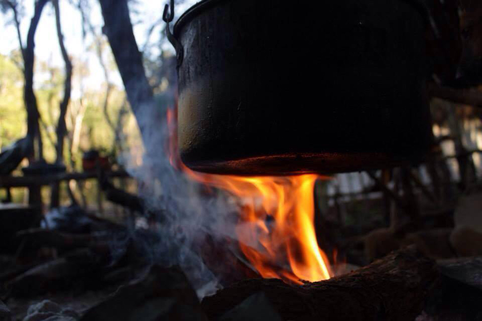 Cooking the old fashioned way. This month we will upgrade into a fully working rocket stove as we get the kitchen ready with cabinets, etc.