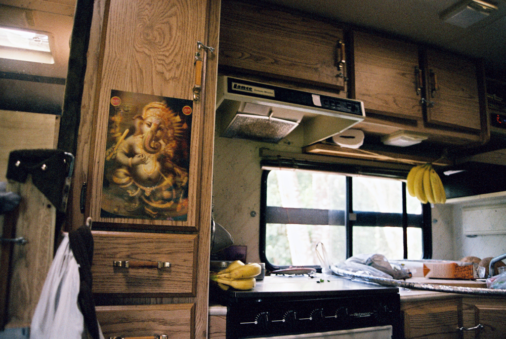 Ganesh with bananas in the kitchen of Garett's solar powered kitchen.