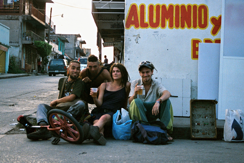 Back in Palenque town: our Mexican friend Lalo (La Locura - The Madness) with his unicycle and a friend, and writer Cat Rainsford and Paul Sargent having some beers after the Rainbow.