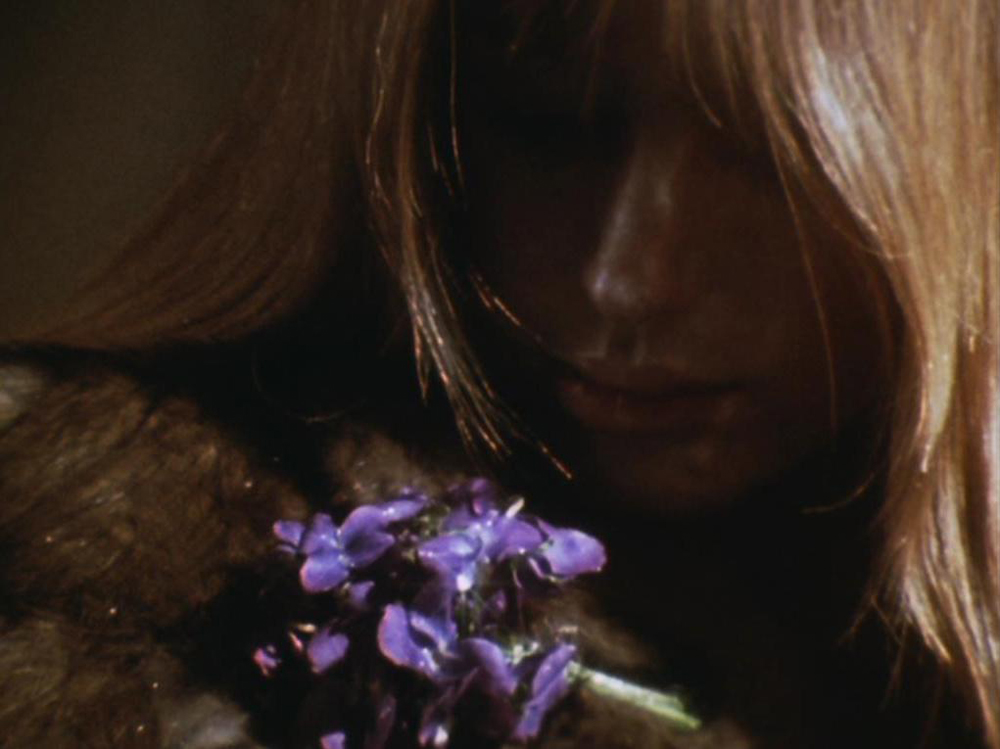 Lilith (Marianne Faithfull) with flowers. A still from Lucifer Rising (1966-1980), a film by Kenneth Anger. Colour, 16mm, 28mins.