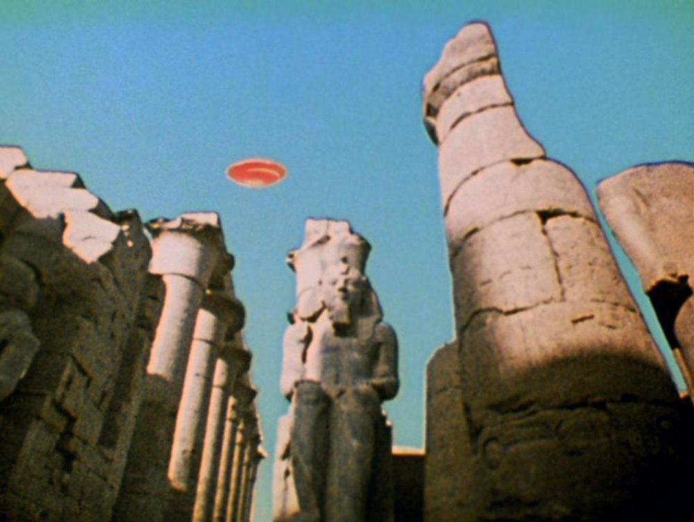 A UFO appearing over Luxor, Egypt. A still from Lucifer Rising (1966-1980), a film by Kenneth Anger. Colour, 16mm, 28mins.