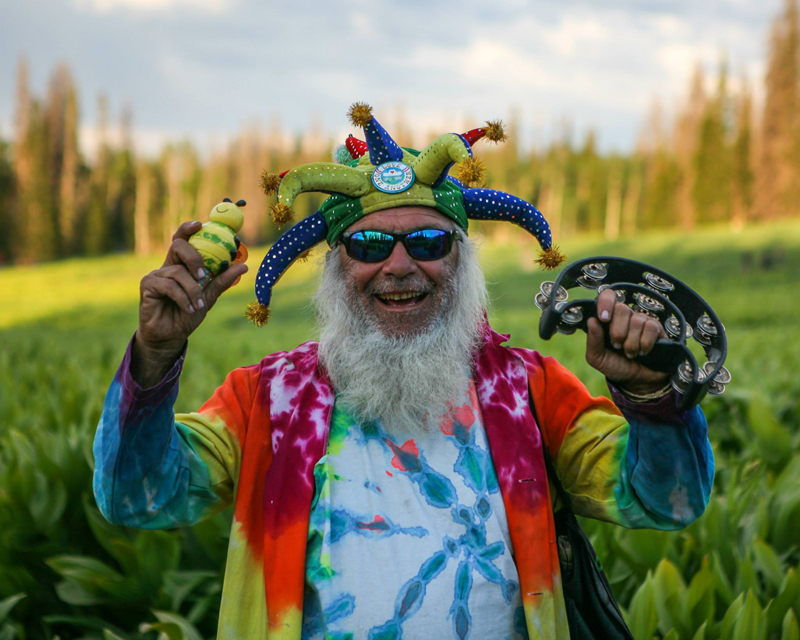 "I am Glowing Feather. Since 1972, I have been at Rainbows but out of the gathering I become the MaJi, pronounced May Jai. My vowels are strong, like my Spirit. I am not the devil, nor a god, nor an angel. I am a being of Light and Love and beam it to all who hear me, see me, feel me. I love to share my positive outlook & share my Joyous spirit." Photo Tyler Coleman.