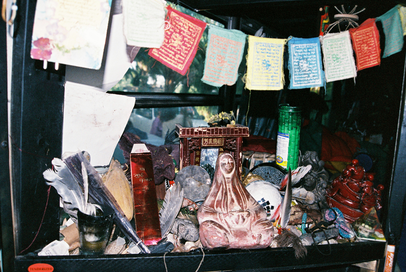 The Third Eye paused for a blessing at the Co-Laboratory's hybrid altar inside the bus.