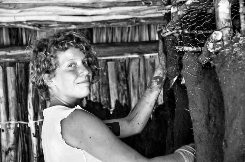 Our good friend Mona from Germany working on building the cob cabinets.