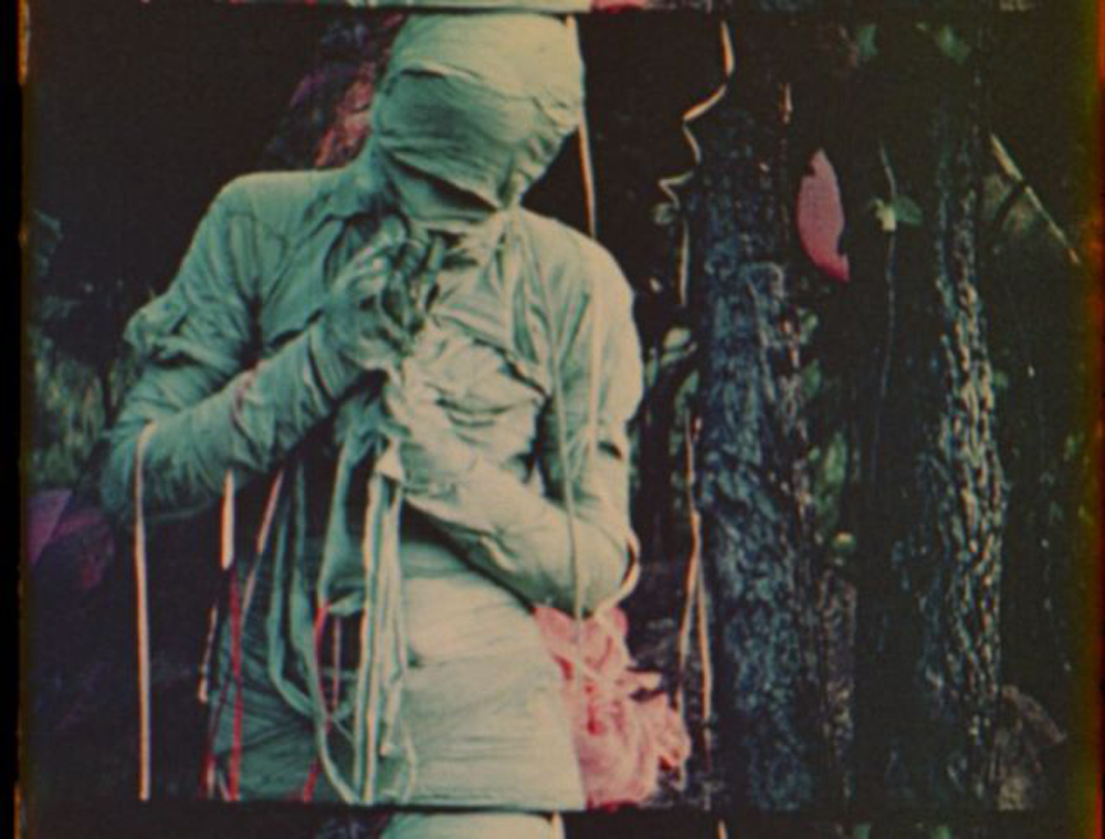 The Mummy. A still from Normal Love (1963) A film by JACK SMITH. Colour, Sound, 16mm, 103 mins.