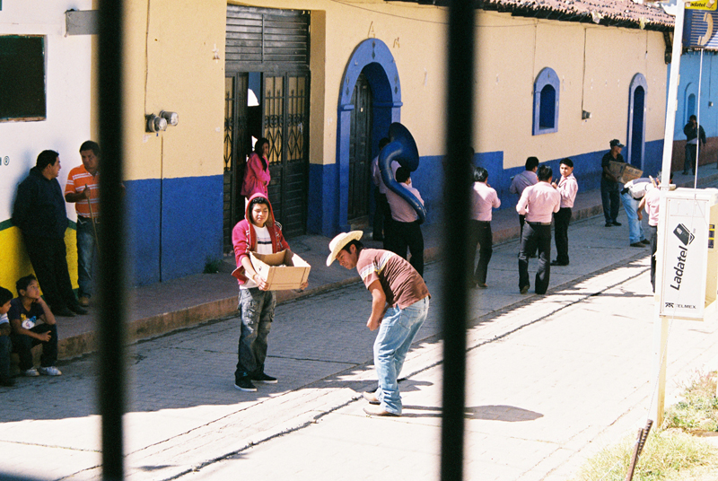 Laying kilometres of gun powder along a street in San Cristobal for New Year's Eve celebrations.