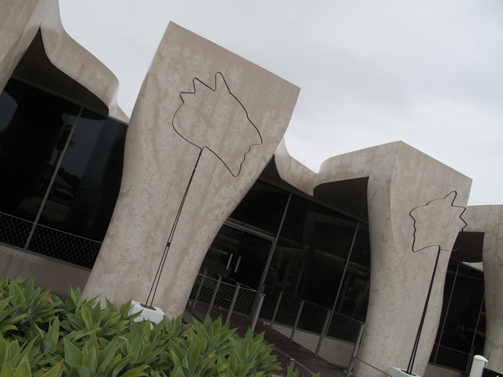 Steel sculptures of Jean Cocteau's profile outside the Musée Jean Cocteau.