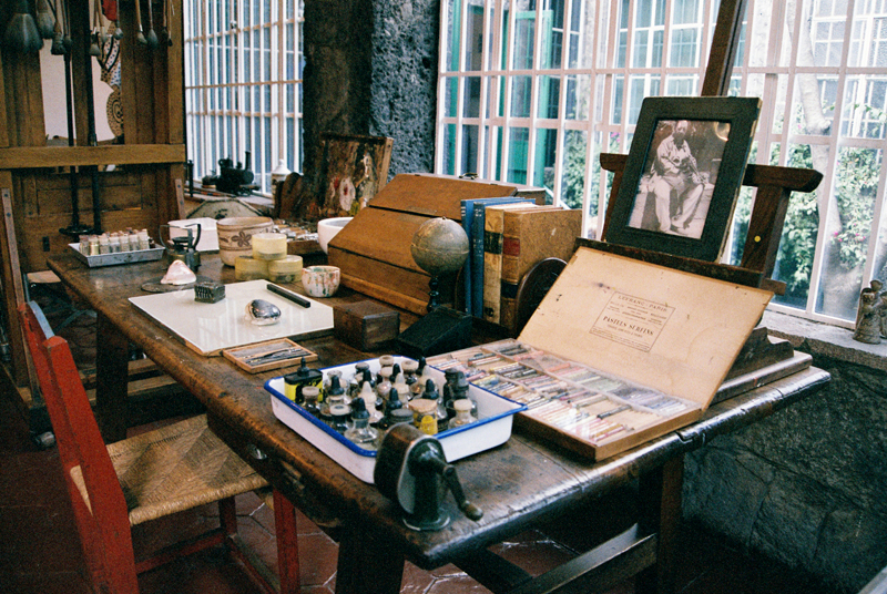 Frida Kahlo's desk with a portrait of Diego Rivera.