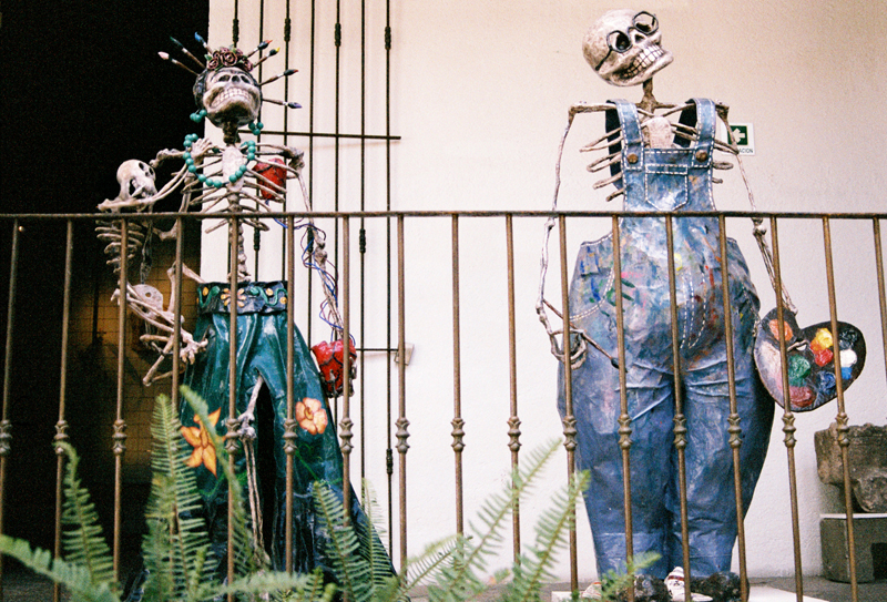 FRIDA AND DIEGO FOREVER. Calavera incarnations of Frida Kahlo (with her pet spider monkey either Fulang Chang or Caimito de Guayabal) and Diego Rivera with his signature workwear overalls.