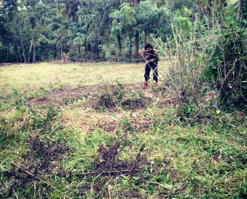 Jaguar preparing the fire circle in the camping area for his festival, Popol Vuh Space Mother Ship, in Palenque, Chiapas, Mexico.