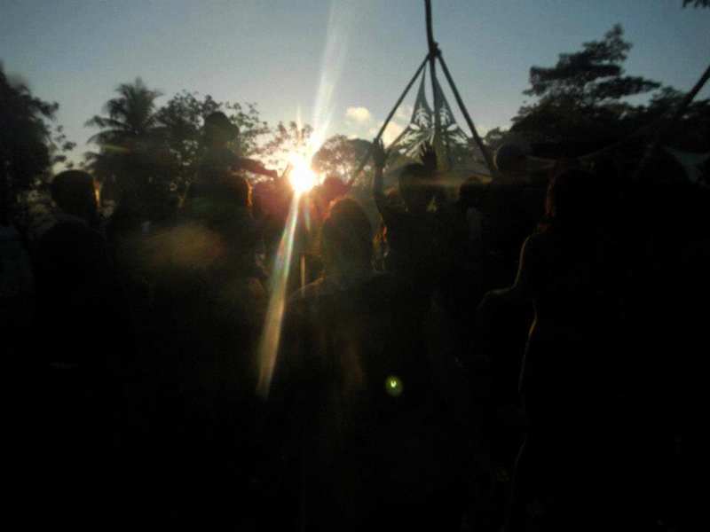 The sun setting over the powerful jungle around the Main Stage.