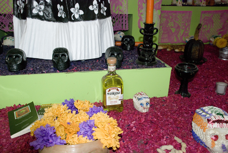 A bottle of Tequila and skulls made with sugar.