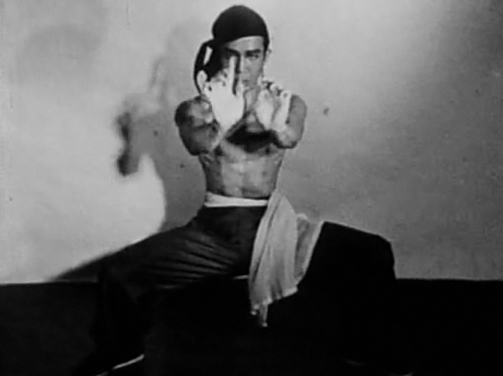 Chao Li-Chi performing. A still from Meditation on Violence (1948) a film by Maya Deren. Black and white, 16mm, 15mins.