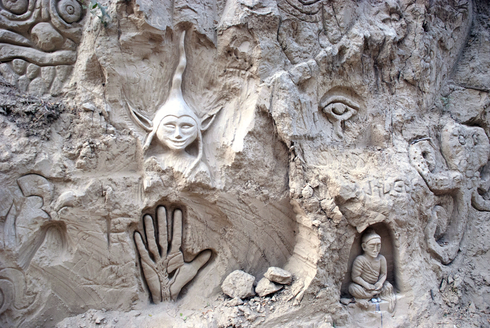 Fantasy, ancient myth and symbolism merging on the cliffs - an Elf manifestation, Buddha and the Hand of Fatima.