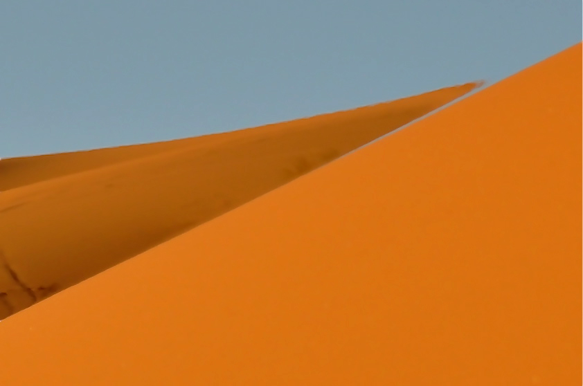 This picture was taken nearly at the top of the highest dune. Note the mirroring of the air, the sky floats down between the two Dunes.