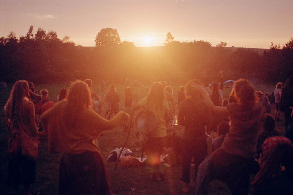 The first sunset after days of rain and no sun coming through, a very magical sundance moment with didgeridoo, drums, flute and the epic sound of a gong, Hungary.