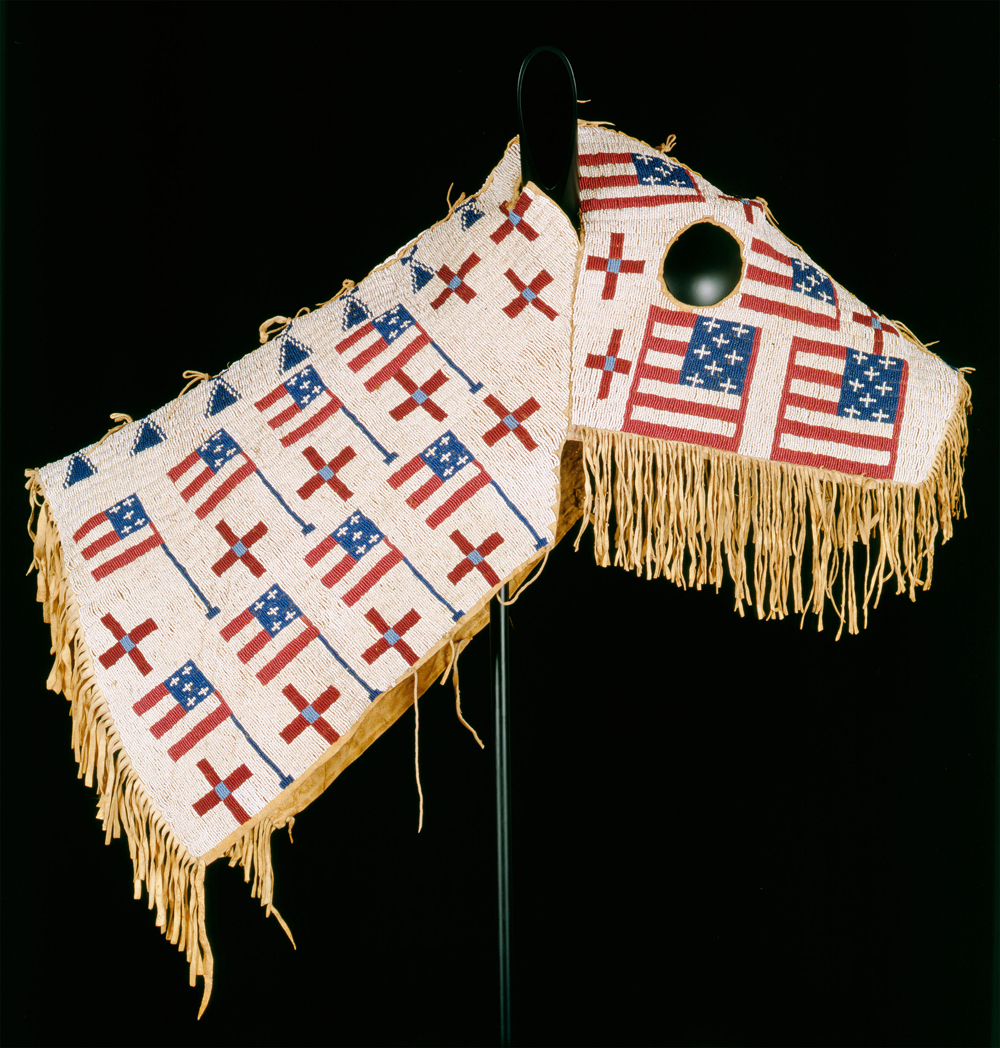 Horse Mask, Blackfeet, 19th century. Tanned buffalo hide, cotton cloth, ribbon, wood, brass tacks, glass beads, ochre (45.7 cm x 26.7 cm) Buffalo Bill Center of the West, Cody, Wyoming, U.S.A.