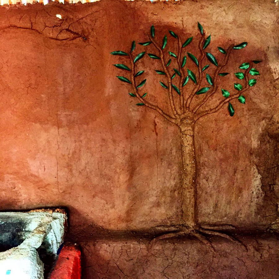 Artwork on the cob walls inside the kitchen. 