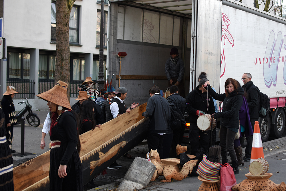 The Lummi Nation helping load the Canoe of Life into a truck, on its way to Le Bourget for exhibition at the Indigenous Pavilion during the COP21. 